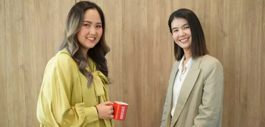 girls smiling and drinking coffee